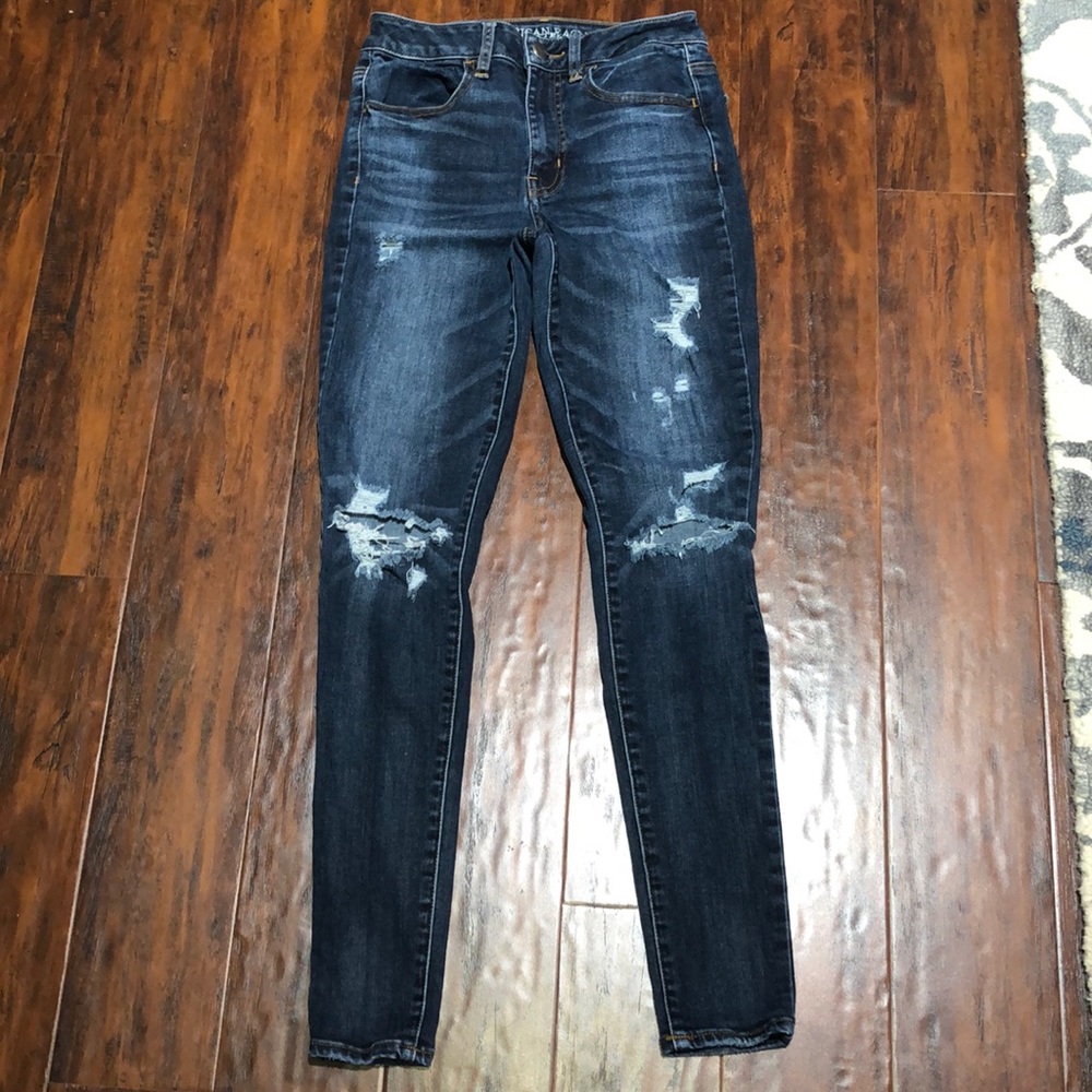 Woman’s ripped blue jean